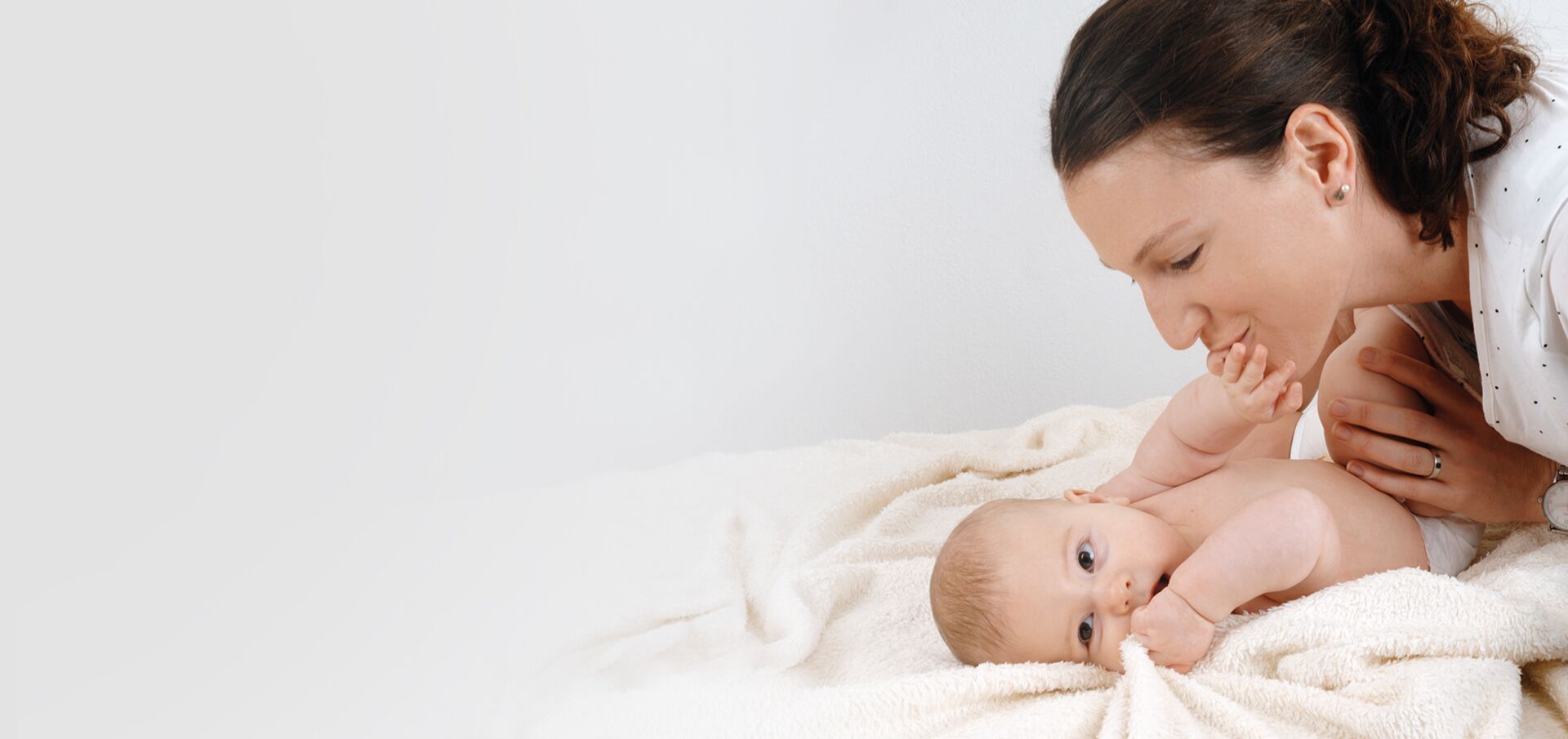 loving mother flirting with baby